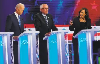  ?? Doug Mills / New York Times ?? Sen. Kamala Harris, DCalif., directs pointed remarks at former Vice President Joe Biden (left) about his opposition to school busing during the Democratic presidenti­al debate in Miami.