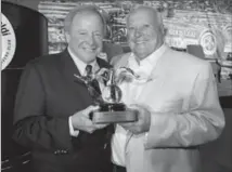  ?? WES DUENKEL, FORD MOTOR COMPANY ?? Edsel Ford II presents the Spirit of Ford Award to driving great and owner A.J. Foyt.