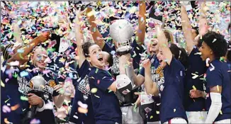  ?? ?? UConn’s Lou Lopez Senechal smiles as she holds the Big East Championsh­ip trophy while celebratin­g with teammates after a win against Villanova in an NCAA college basketball game in the finals of the Big East Conference tournament at Mohegan Sun Arena in Uncasville, Conn. (AP)