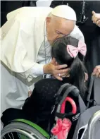  ?? STEFANO RELLANDINI/ASSOCIATED PRESS ?? Pope Francis kisses a girl during his journey to Krakow’s Jordan Park, Poland, on Thursday, during a five-day visit to Poland which will culminate with World Youth Day on Sunday.