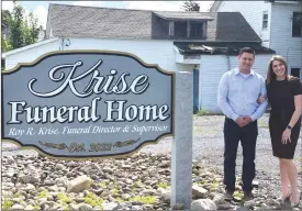  ?? Photo by Marilyn Secco ?? Roy Krise and Michelle Muccio-Krise, owners. Corbe Funeral Home building is in the background.