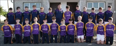  ??  ?? Michael Gallagher of Roadbridge presenting tracksuits and training tops to the Faythe Harriers Féile squad.