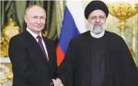  ?? (Sputnik/Sergei Bobylev/Pool via Reuters) ?? RUSSIAN PRESIDENT Vladimir Putin meets with Iranian President Ebrahim Raisi in Moscow in December.