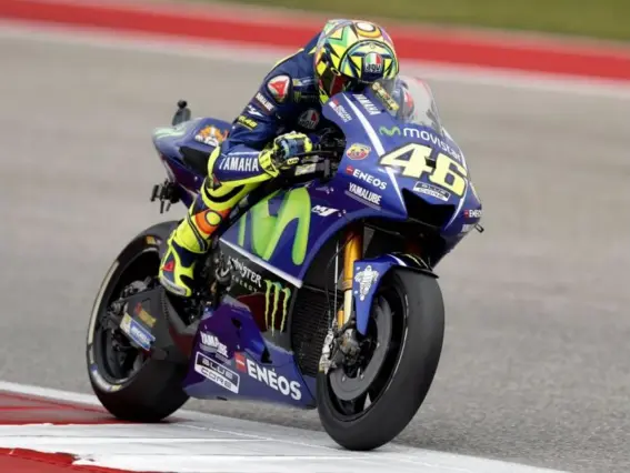  ?? (EPA) ?? Valentino Rossi received a time penalty for cutting turn four after clashing with Johann Zarco