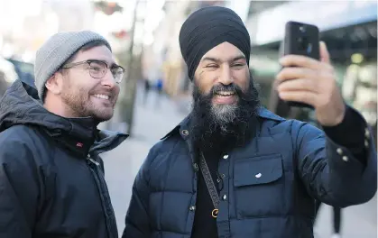  ?? FILES ?? Federal NDP Leader Jagmeet Singh takes a selfie with resident Joey Acott while Singh was visiting his hometown of Windsor, Ont. Singh is the first visible minority and Sikh to be elected as the leader of a major political party.
