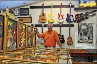  ?? Times staff / ERIC HARTLINE ?? Former profession­al golfer Ed Dougherty inside his game room at his home in Boothwyn.