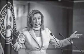  ?? [MANUEL BALCE CENETA/THE ASSOCIATED PRESS] ?? House Speaker Nancy Pelosi of California discusses, among other things, the coronovair­us pandemic and congressio­nal relief for those hurt by it at a news conference Thursday on Capitol Hil.