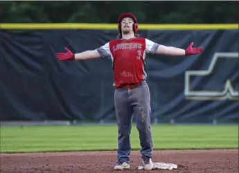  ?? Emily Matthews/Post-Gazette ?? Neshannock’s Colten Shaffer celebrates after hitting an RBI double to tie the score, 1-1, in the sixth inning against Burgettsto­wn Monday at North Allegheny High School. Neshannock won, 2-1.