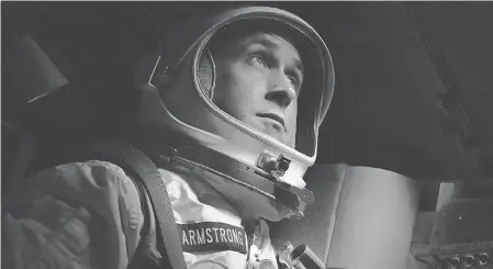  ?? DANIEL MCFADDEN/UNIVERSAL ?? Neil Armstrong (Ryan Gosling) beholds the majesty of space in the historical drama “First Man,” which opens nationwide on Friday.