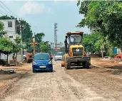  ?? — DC ?? Ahead of bypolls, earthmover­s level the ground to lay a new layer over a damaged road on the Choutuppal­gudimalkap­uram stretch in Munugode.