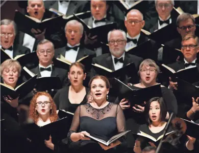  ?? JONATHAN KIRN / MILWAUKEE SYMPHONY ?? The Milwaukee Symphony Chorus, seen here singing Handel’s “Messiah” with soprano Sari Gruber, will perform Mozart’s “Requiem” Friday through next Sunday at St. Josaphat Basilica.