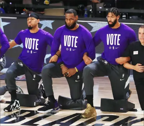  ?? Mike Ehrmann/ Getty Images ?? Even as the Lakers were pointed toward their first NBA championsh­ip in a decade inside the league’s Florida bubble, LeBron James was also advocating for people to vote and be heard.