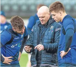  ?? Pictures: Getty/sns. ?? Stuart Hogg, top, is challenged by Keith Earls and Garry Ringrose during Scotland’s defeat in Dublin last weekend; right: the Scotland full-back in training yesterday ahead of the trip to Italy; above: head coach Gregor Townsend talks tactics with Ryan...