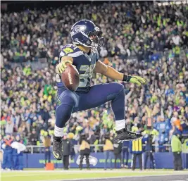  ?? ELAINE THOMPSON/ASSOCIATED PRESS ?? Seahawks running back Thomas Rawls reacts after scoring a touchdown against the Lions on Saturday.