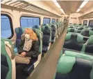  ?? SETH HARRISON/USA TODAY NETWORK ?? Lori Glazer of Ossining, N.Y., rides the empty Metro-North train into New York City during what would typically be morning rush hour on Wednesday. Glazer works as a registered nurse.