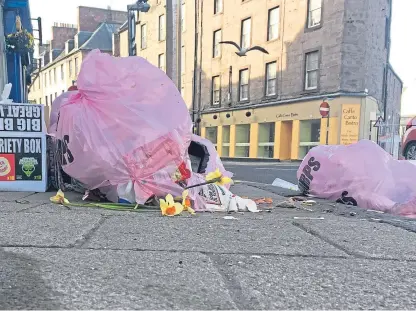  ??  ?? The proposed scheme will mean the end of free pink sacks for city centre properties.