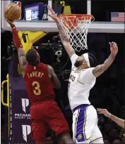  ?? KEVORK DJANSEZIAN — GETTY IMAGES ?? The Lakers' Anthony Davis elevates to block a layup by Caris LeVert of the Cavaliers during Saturday's victory.