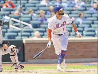  ?? Kathy Willens / Associated Press ?? New York’s Kevin Pillar watches his second-inning, two-run triple that carried the Mets over the Orioles for their seventh straight win.