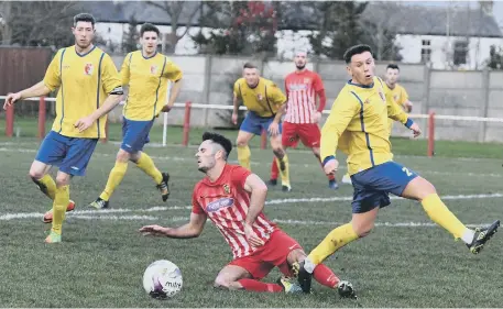  ??  ?? Ryhope CW (red) take on Sunderland RCA in last week’s First Division derby. Pictures by Kevin Brady.