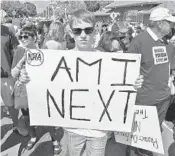  ?? JIM RASSOL/STAFF PHOTOGRAPH­ER ?? Owen Schneider of Ohio joined the group of people who marched from Boca Raton City Hall to the Mizner Park Amphitheat­er, where students took turns speaking.