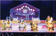  ?? DARREN THOMAS VIA AP ?? This image shows characters, from left, Bandit, Bluey, Bingo and Chili and their puppeteers during a performanc­e of “Bluey’s Big Play.” The theatrical adaptation of the popular animated children’s TV show “Bluey” starts a multistate tour this month.