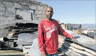  ?? Picture: KAREN VAN ROOYEN ?? CARRYING ON: Constructi­on worker Seti Skosana, 57, has started to rebuild his home after it was destroyed in the fire that devastated Knysna last week
