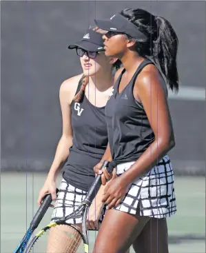  ??  ?? Katharine Lotze/The Signal (See additional photos on signalscv.com) (Above) Golden Valley’s Helen Sarpong returns a shot to her opponent during a tennis match at West Ranch on Tuesday, (Right) Golden Valley first doubles players Kaylah Fernando and...