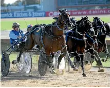  ?? PHOTO: RACE IMAGES ?? AG’s White Socks (outside) reined by Ricky May runs past More The Better (centre) to win Saturday’s Easter Cup at Addington.