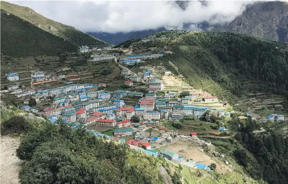  ??  ?? The hillside community of Namche, sitting at an elevation of 3,440 metres at its lowest point, is the largest town visited during the trek.