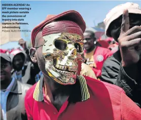  ?? Picture: ALAISTER RUSSELL ?? HIDDEN AGENDA? An EFF member wearing a mask pickets outside the commission of inquiry into state capture in Parktown, Johannesbu­rg