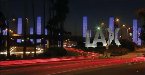  ?? Photo/AP/Reed Saxon) ?? Lighted pylons are seen Nov. 2, 2013, at the Century Boulevard entrance to Los Angeles Internatio­nal Airport. Stories circulatin­g online incorrectl­y claim Los Angeles Internatio­nal Airport is adding urinals to its women’s restrooms.
(File