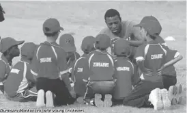  ??  ?? Dumisani Mankunzini with young cricketers