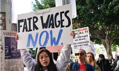  ?? Photograph: Frederic J Brown/AFP/Getty Images ?? Hospitalit­y workers picket outside Hotel Figueroa in downtown LA on 5 April 2024.