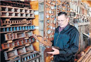  ?? PAT BRENNAN SPECIAL TO THE STAR ?? Vernon Wheeler looks at equipment used hundreds of years ago to collect sap from maple trees at the Maple Syrup Museum on his property near McDonald’s Corners, Ont.