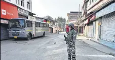  ?? AFP ?? A soldier stands guard at a street in Srinagar on August 5.
