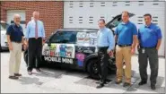  ?? SUBMITTED PHOTO ?? Montgomery County District Attorney Kevin R. Steele, second from the left, is joined by Pennsylvan­ia American Water officials to unveil the latest addition to his Drug Take Back program. It’s dubbed the “Pill Take Back Mobile MINI” and it could be coming to an event near you.