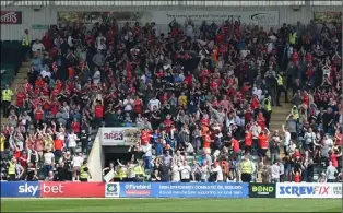  ?? ?? Last time: Barnsley fans celebrate their 3-0 victory at Home Park in April 2019.