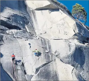  ??  ?? ALMOST THERE: Tommy Caldwell and Kevin Jorgeson near the summit of the 3,000ft vertical wall.
