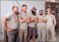  ?? LAUREN VILLAGRAN/JOURNAL ?? Ricky Davis, Chris Rickert, Thomas Gathman, Rob Voorhis and Andrew Brennan gather for a photo at the Hachita community center on Saturday, the day before the launch of their 3,100mile hike of the Continenta­l Divide Trail. A sixth hiker, Korean War...