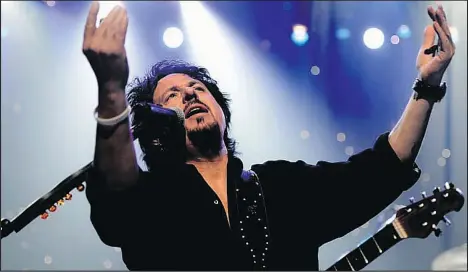  ?? — GETTY IMAGES FILES ?? In this file photo, Toto’s Steve Lukather is seen performing at the Hyperion Theater in Anaheim, Calif. — a long way from the Namib coastal desert in Africa.