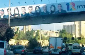  ?? (Courtesy) ?? THE DEFACED ‘Eretz Nehederet’ sign is seen above the capital’s Begin Highway earlier this week.
