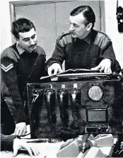  ??  ?? Hywel-jones, right, gives a briefing in the battalion operations room in Belfast, 1973