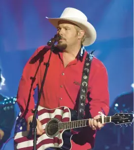  ?? MARK HUMPHREY/AP 2002 ?? Toby Keith performs his song “Courtesy of the Red, White and Blue (The Angry American),” which reflected how many people felt after 9/11 terrorist attacks.