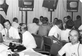  ??  ?? ▲ Action stations: Jerry Woodfill (left) is on hand for any hardware queries in the mission evaluation room during the Apollo 11 mission