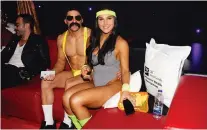  ?? VINCENZO D’ALTO ?? BUFF BORAT: Jon Chaimburg, owner/head trainer at Adrenaline Performanc­e Center, dresses as Borat to the delight of donors who raised more than $10,500 to see him do so. He sits with love Maddy (Jane Fonda) Jovadi, trainer, Adrenaline Performanc­e Center.