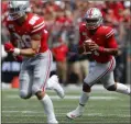  ?? JAY LAPRETE — THE ASSOCIATED PRESS ?? Ohio State quarterbac­k Justin Fields looks for an open receiver against Florida Atlantic during the first half of Aug. 31 in Columbus.