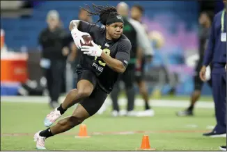  ??  ?? In this Feb 28, 2020, file photo, Maryland running back Anthony McFarland runs a drill at the NFL football scouting combine in Indianapol­is. Steelers rookie running back Anthony McFarland is doing Zoom meetings with coaches and then heading outside to see if he’s lining up in the right spots. Yeah, it’s weird, but he and his fellow rookies
are making due.