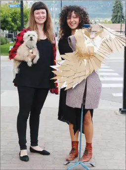  ?? TIFFANY GOODWEIN/Special to The Herald ?? Jordan Keis, left, and Vaelei Walkden-Brown display a piece of art that will be featured in ARTwear: A Wearable Art Show, Sunday at the Cannery Brewing Company on Ellis Street, beginning at 6 p.m.