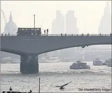  ??  ?? HAZE HANGING: Air pollution and smog in central London – alerts were issued last week as levels spiked Dan Kitwood/Getty Images