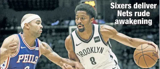  ?? Paul J. Bereswill ?? NO LONGER PERFECT: Spencer Dinwiddie, dribbling against Jerryd Bayless, and the Nets lost their first preseason game and final tune-up for the regular season, 133-114, to the 76ers on Wednesday night at the Nassau Coliseum.